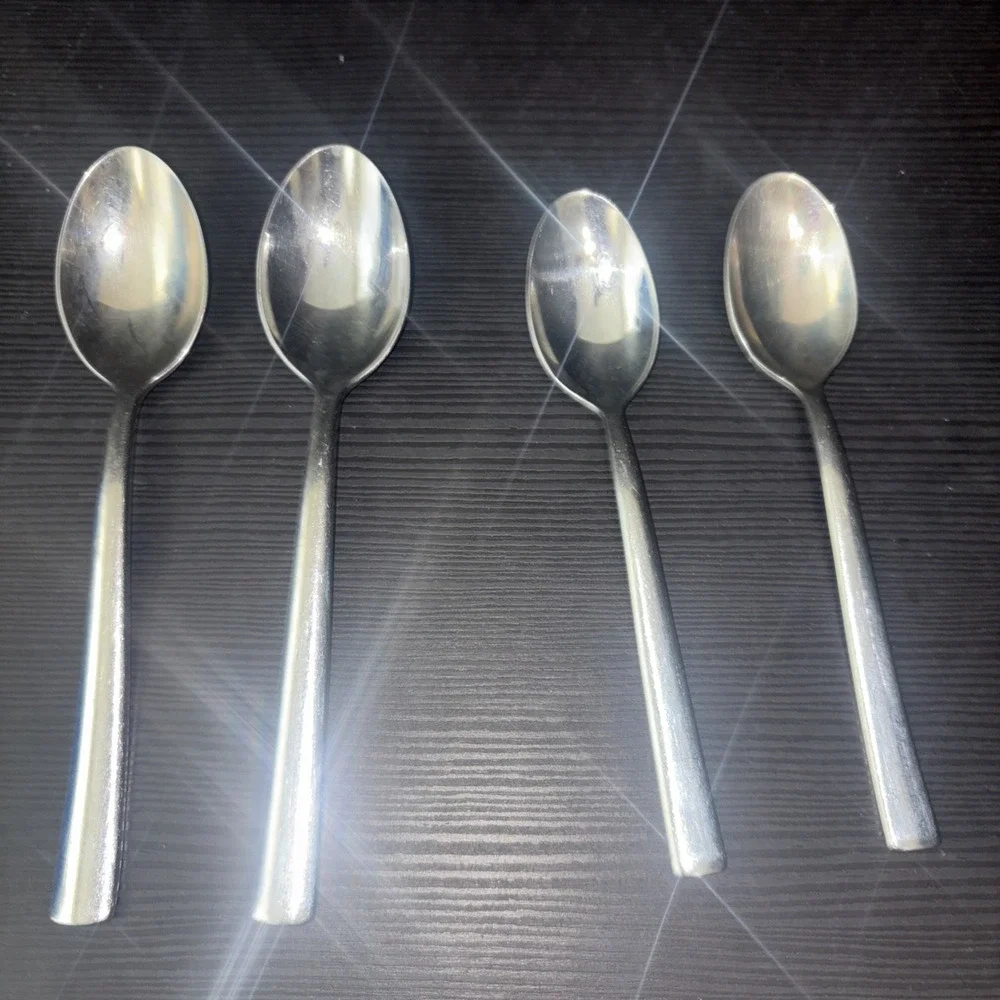 8 Piece Lot of JA Henckels Int. Stainless Steel Knives And Spoons